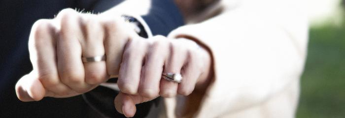 married couple hands with wedding rings